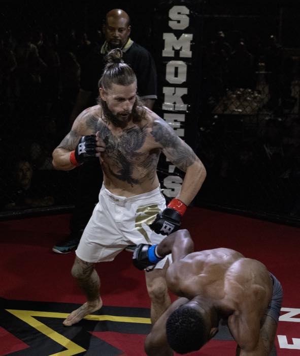 Mixed martial arts fighter moving forward during a bout